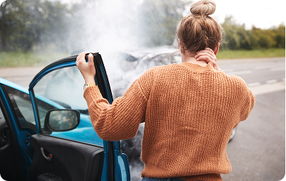 Woman holding her neck after a car accident